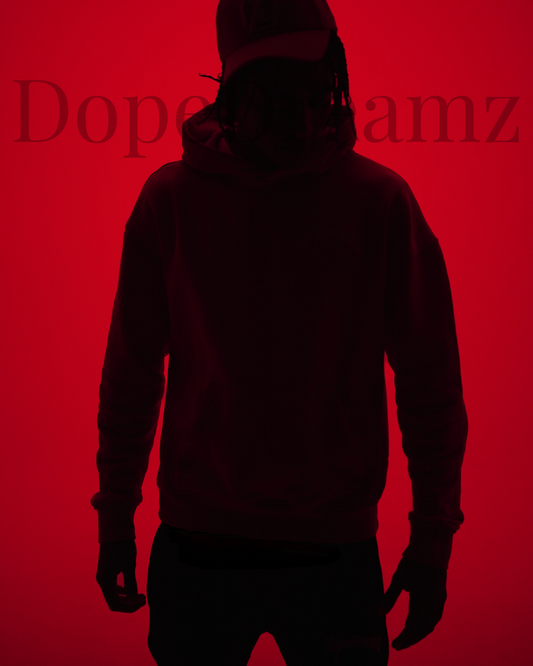 Silhouette of a person standing against a red back ground, representing strength, resilience and pressure.  