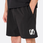 Close-up of the DopeDreamz Interlude Noir black premium shorts featuring the white embroidered DDZ logo and side pocket, three-quarter view.