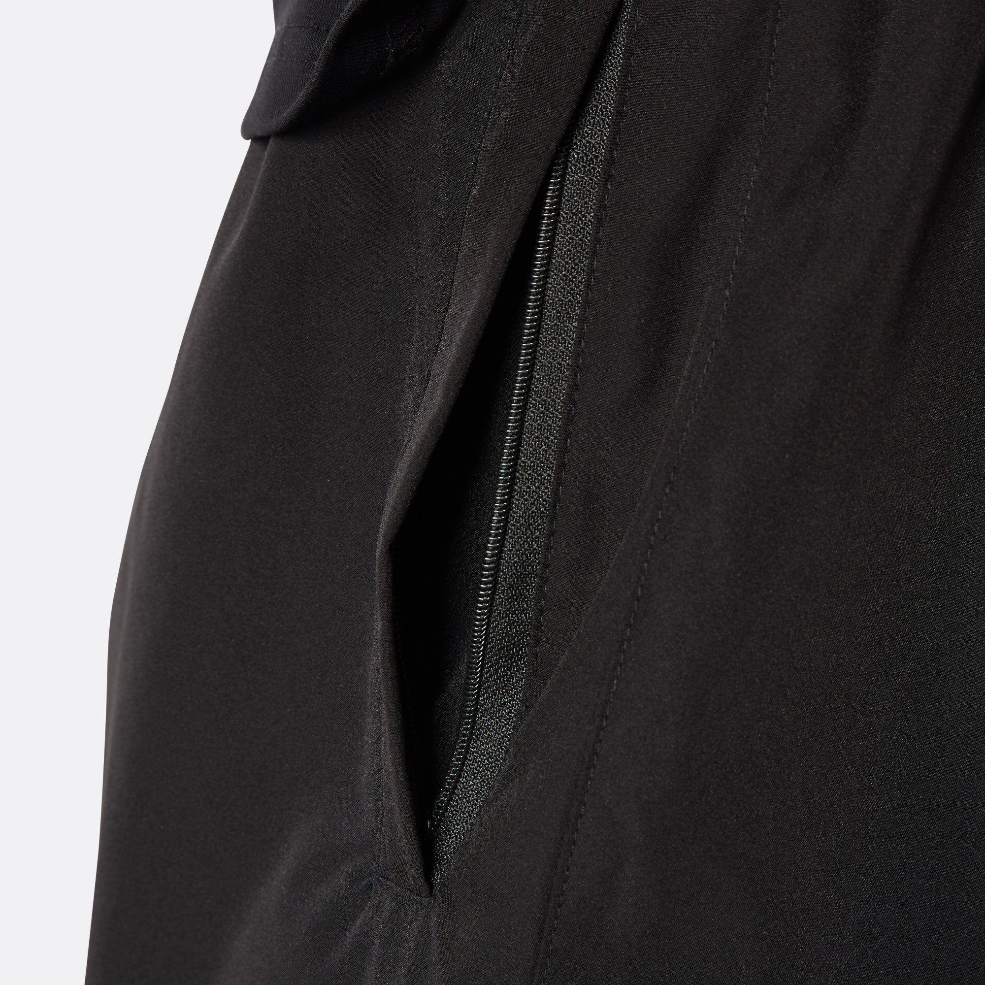Close-up of the DopeDreamz Interlude Noir black premium shorts featuring the concealed zip pocket.