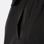 Close-up of the concealed black zip pocket on the DopeDreamz Interlude Noir black premium shorts.