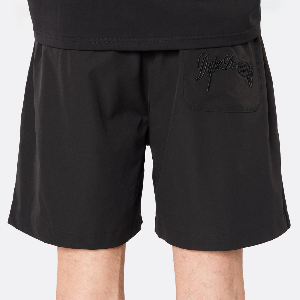 Detailed rear view highlighting the tonal embroidered DopeDreamz script logo, delivering a clean, understated finish.
