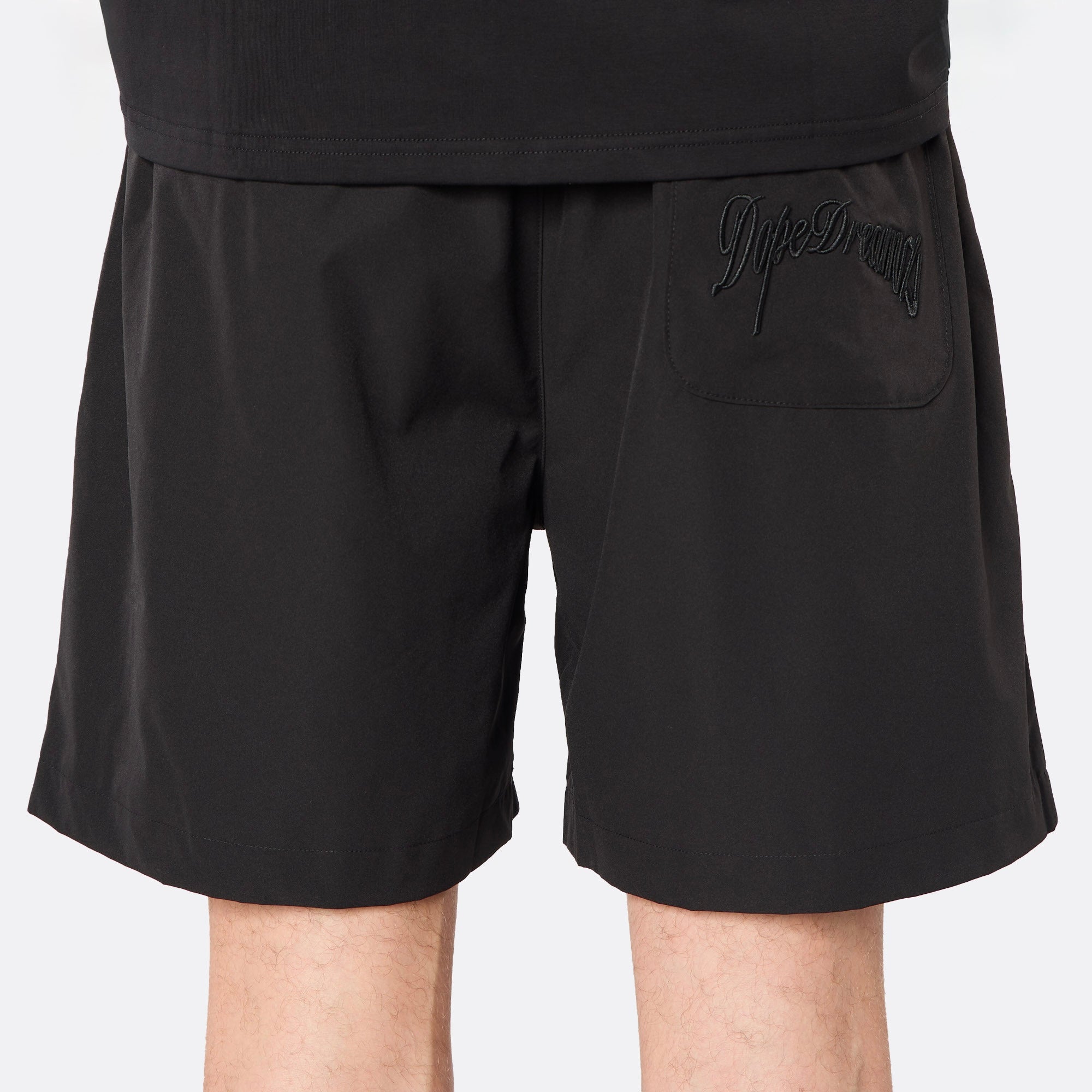 Detailed rear view highlighting the tonal embroidered DopeDreamz script logo, delivering a clean, understated finish.