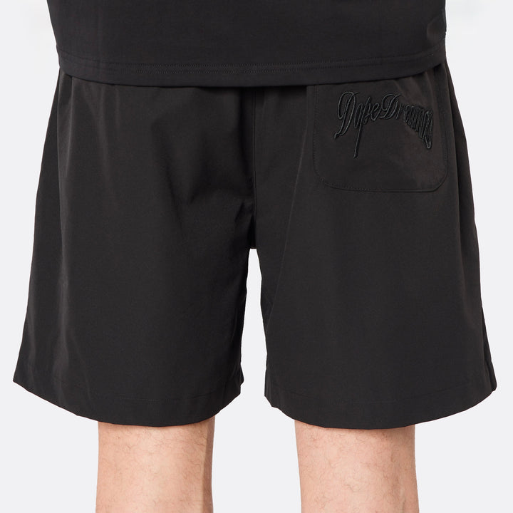 Detailed rear view highlighting the tonal embroidered DopeDreamz script logo, delivering a clean, understated finish.