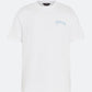 White DopeDreamz t-shirt with blue 3D embroidered chest logo, front view on light background
