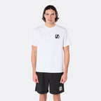Male model wearing the DopeDreamz Interlude Noir white premium T-shirt with black DDZ chest logo and black shorts with white DDZ logo, close-up front view.