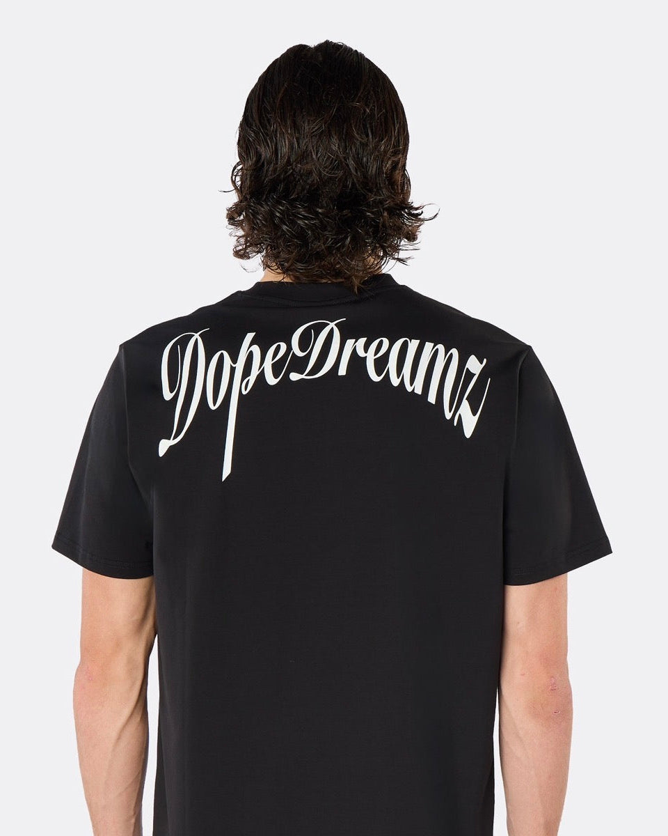 Close-up back view of the DopeDreamz Interlude Noir black premium T-shirt featuring the white DopeDreamz back graphic.