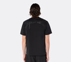 Male model wearing the DopeDreamz Interlude Noir black premium T-shirt with tonal black DopeDreamz back graphic and black shorts with tonal black DopeDreamz logo, back view.