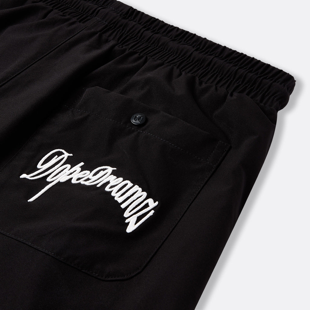     Black DopeDreamz Interlude Noir shorts detail of back pocket with white embroidered DopeDreamz logo and branded button