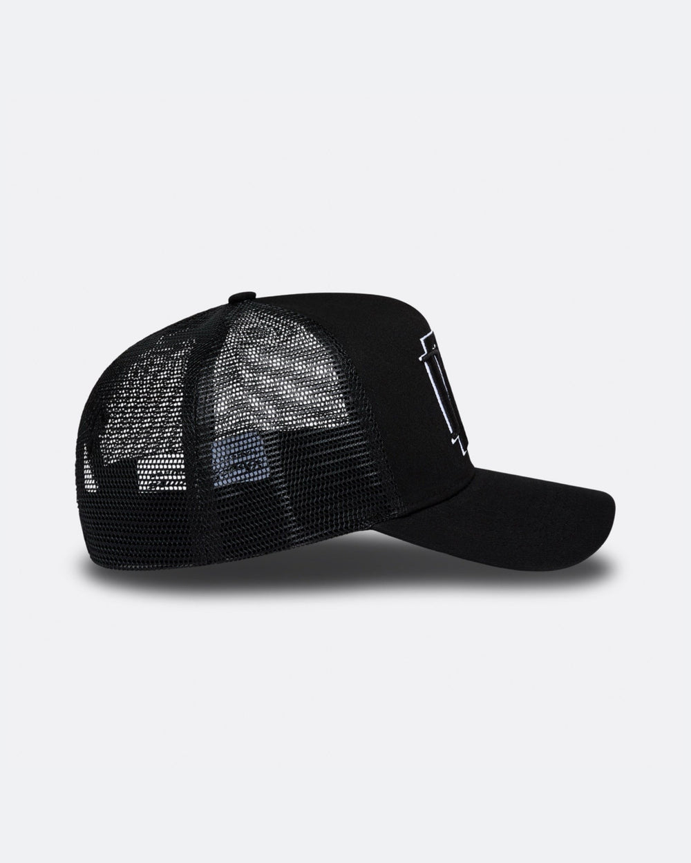 Black DopeDreamz Interlude Noir trucker cap side view with black mesh panels