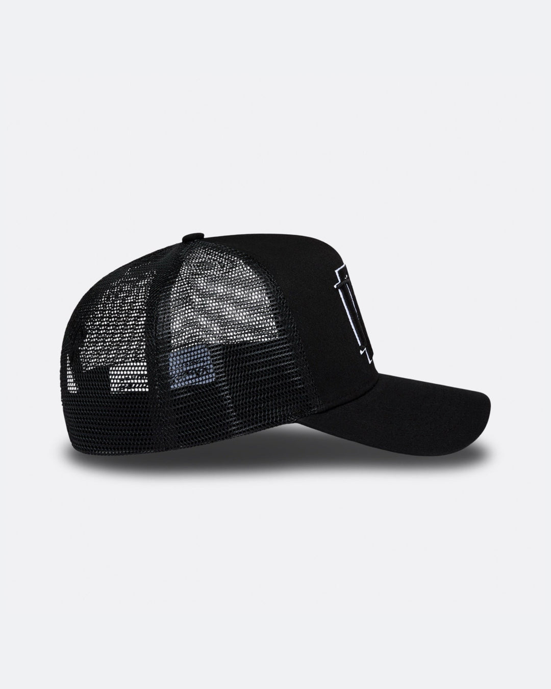 Black DopeDreamz Interlude Noir trucker cap side view with black mesh panels