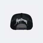 Black DopeDreamz Interlude Noir trucker cap back view with white embroidered DopeDreamz logo and adjustable snapback closure