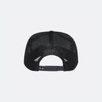 Black DopeDreamz Interlude Noir trucker cap back view with black embroidered DopeDreamz logo and adjustable snapback closure